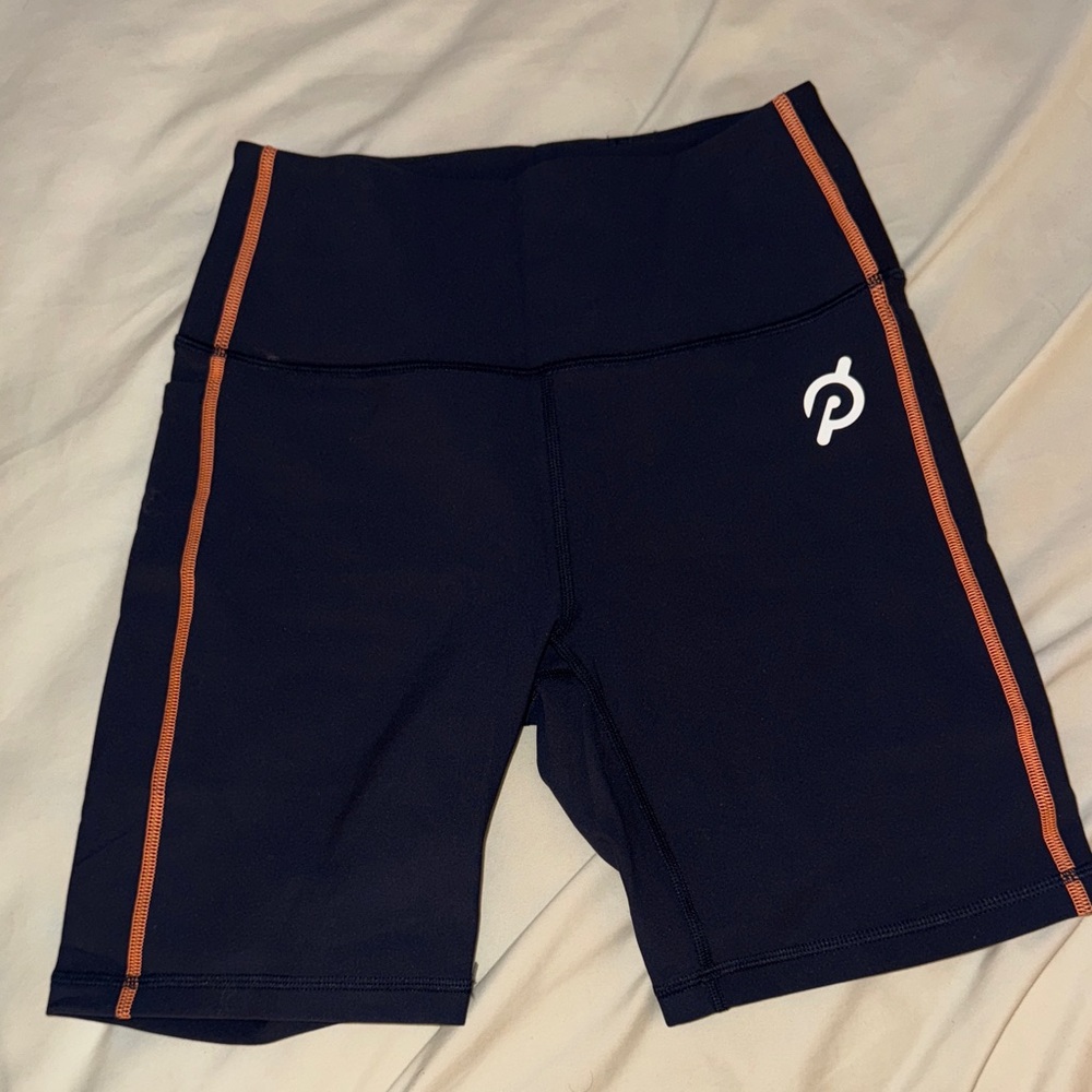 Peloton Women's Dark Blue Bike Shorts with Orange Stripes